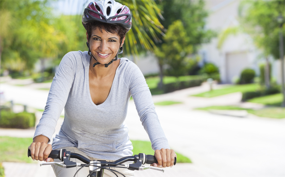 African American Woman Riding Bike